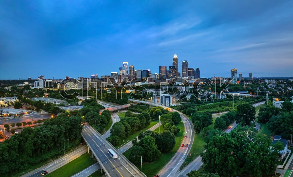 Aerial cityscape of Charlotte, NC at sunset with vivid skyline