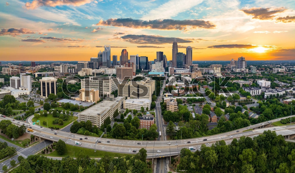 Aerial view of Charlotte, NC at sunrise with cityscape