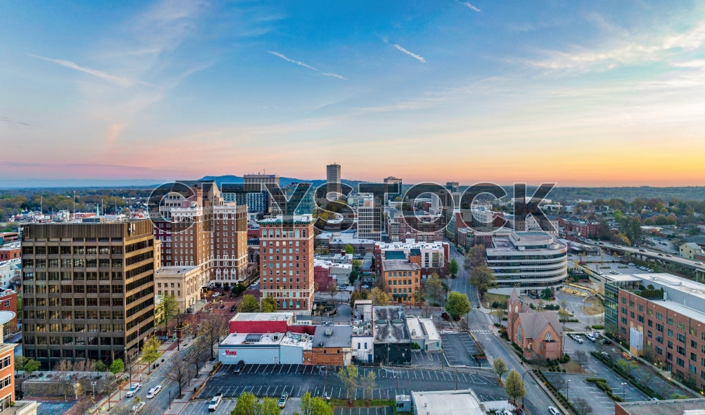 Aerial view of Greenville, SC at sunrise, highlighting urban landscape