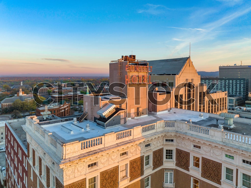 Sunrise lighting up the Poinsett Hotel and cityscape in Greenville, SC