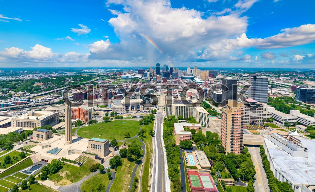 Aerial view of Kansas City's skyline under a rainbow