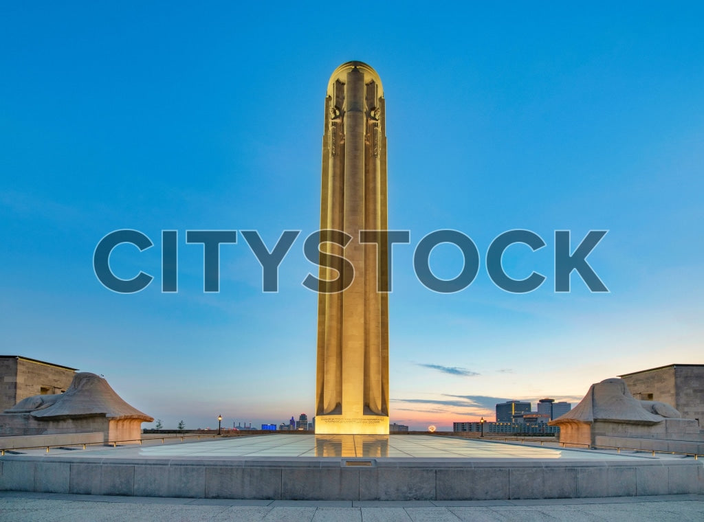 Sunrise at the World War I Memorial in Kansas City with a serene blue sky and city skyline