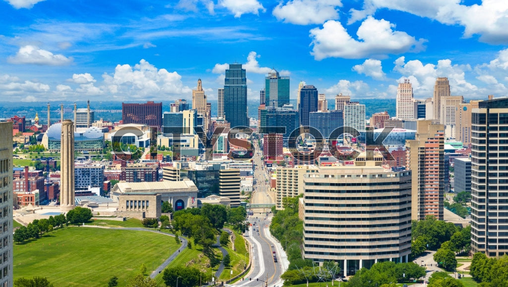 Aerial view of Kansas City skyline with clear blue skies and lush green areas