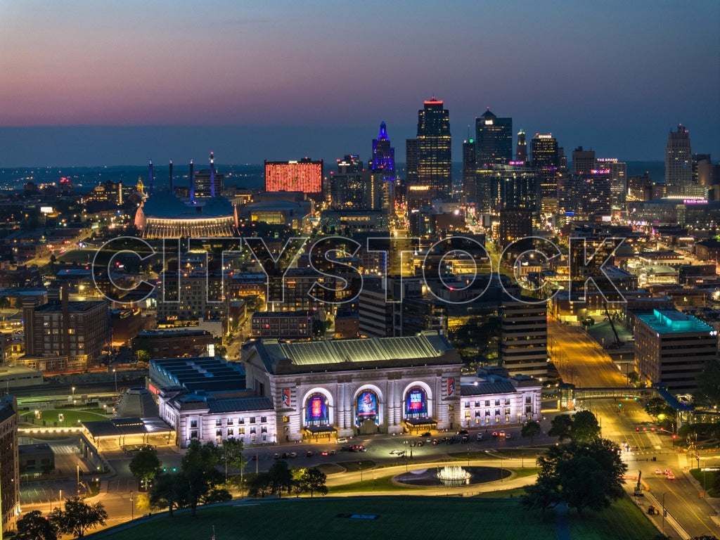 Aerial view of Kansas City skyline and illuminated Union Station at twilight