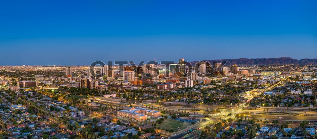 Aerial view of Phoenix, Arizona during twilight with city lights
