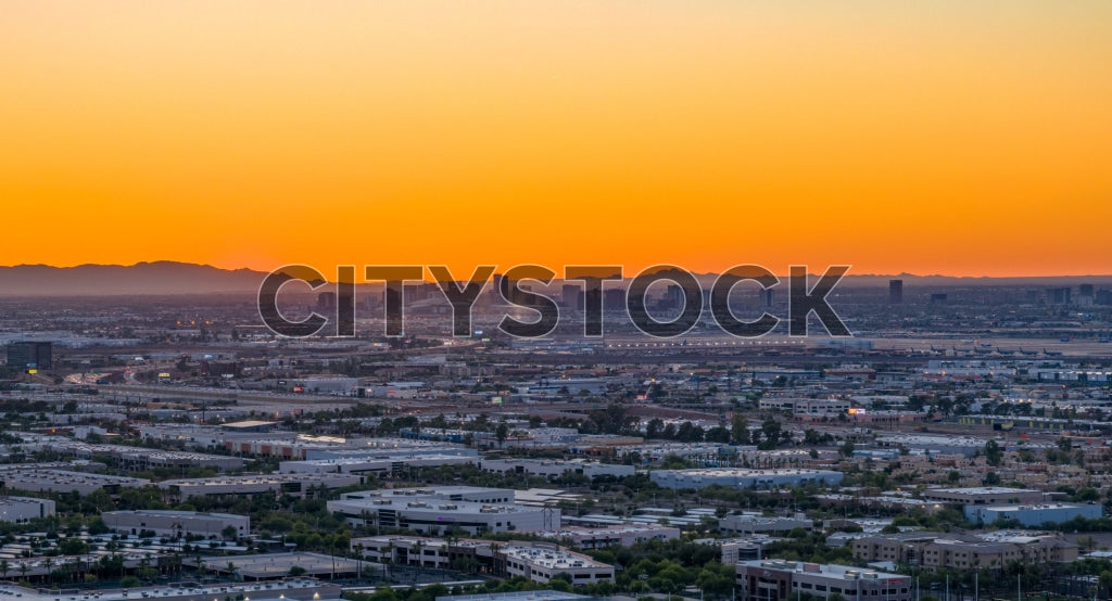 Aerial view of Phoenix at sunrise showing cityscape and mountains