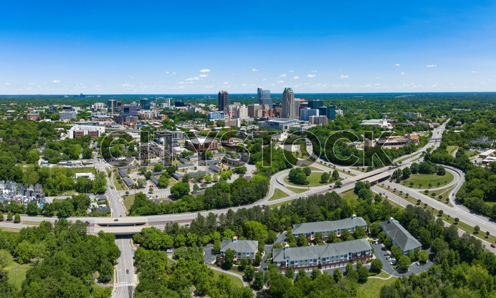 Aerial view of Raleigh NC, showcasing cityscape and greenery