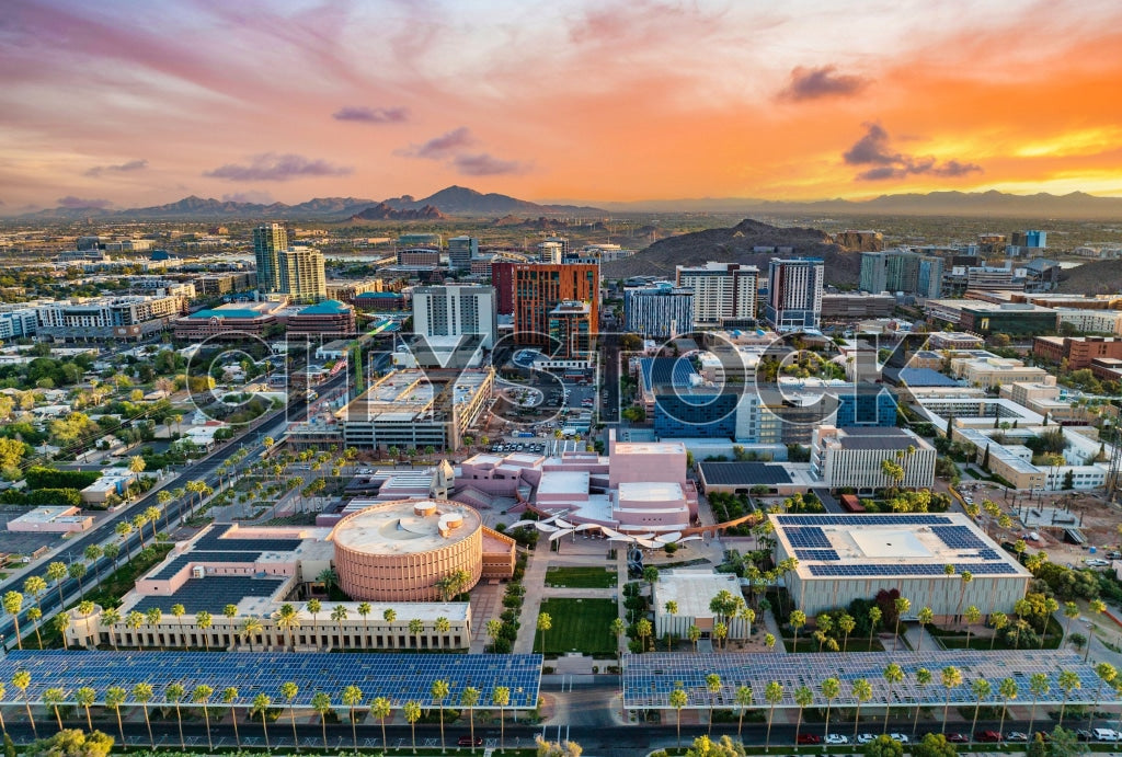 Aerial view of Tempe, Arizona's urban skyline at sunset highlighting sustainability.