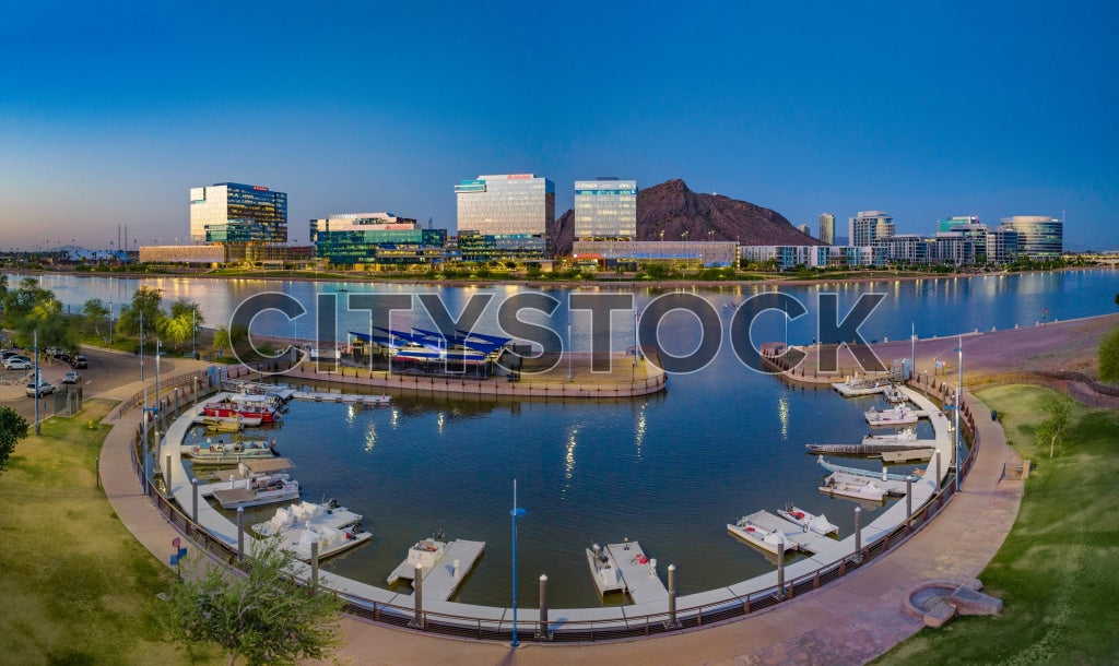 Sunset over Tempe Town Lake Marina with city buildings in background