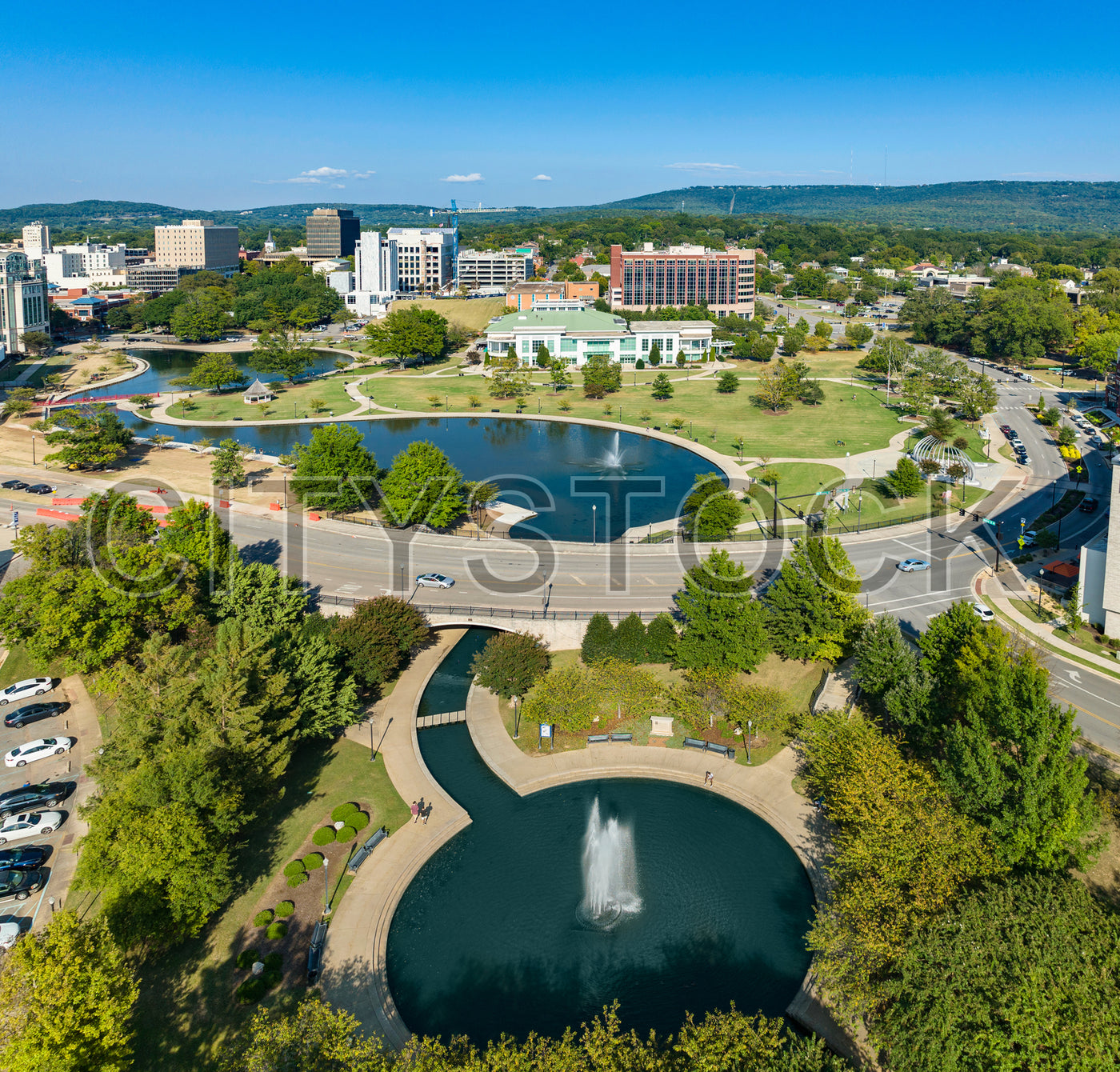 Aerial view of Huntsville city park with lush greenery and buildings