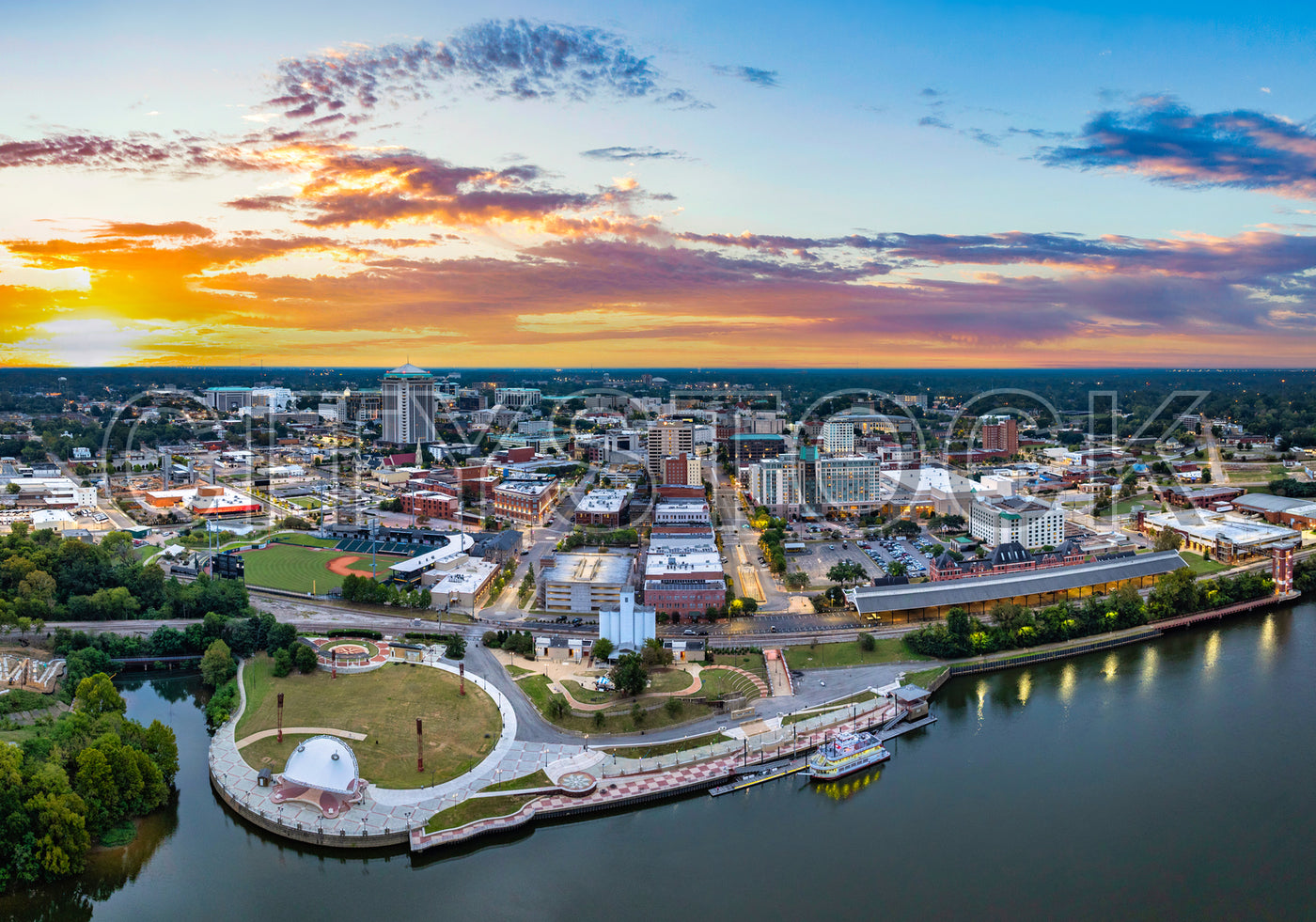 Aerial view of Montgomery, Alabama at sunset with vivid cityscape and river