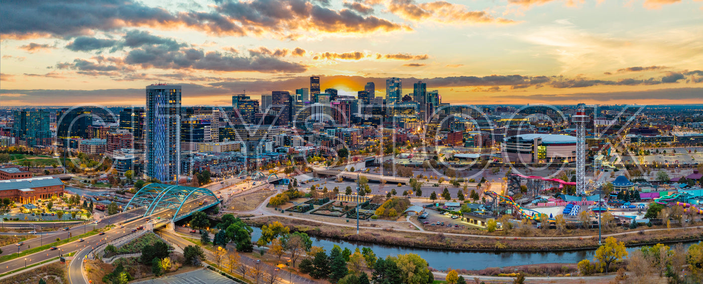 Panoramic view of Denver skyline with sunset and modern buildings