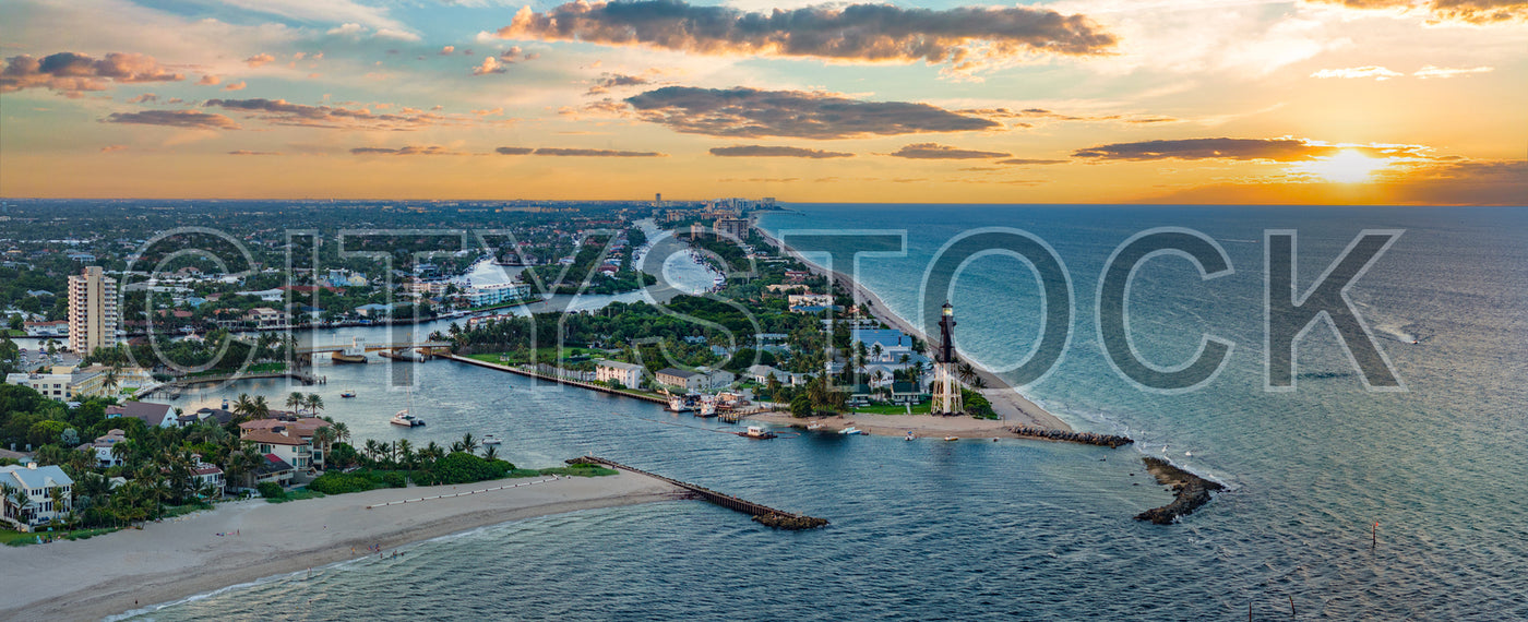 Aerial sunset view of Deerfield Beach with lighthouse and boats, Florida