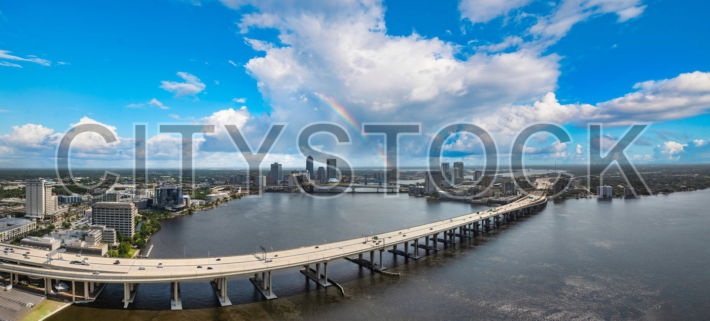 Panoramic view of Jacksonville skyline, river, and rainbow