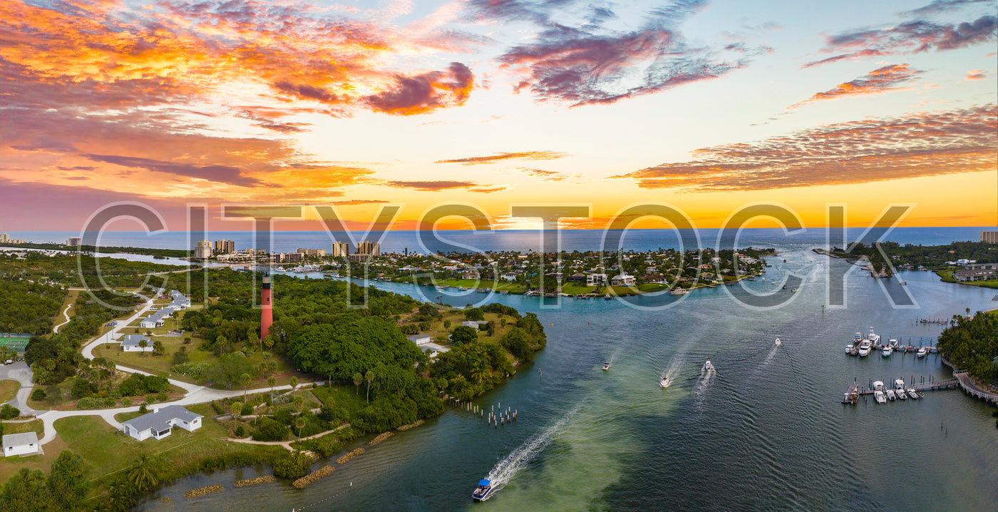 Aerial view of Jupiter Lighthouse and marina at sunset in Florida