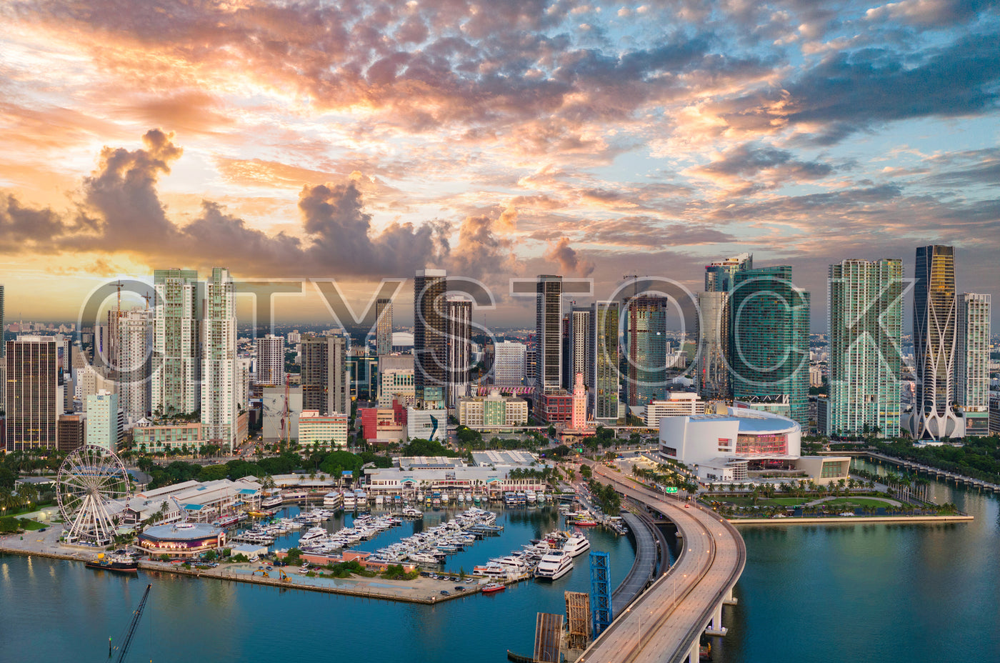 Miami skyline and marina under sunset clouds