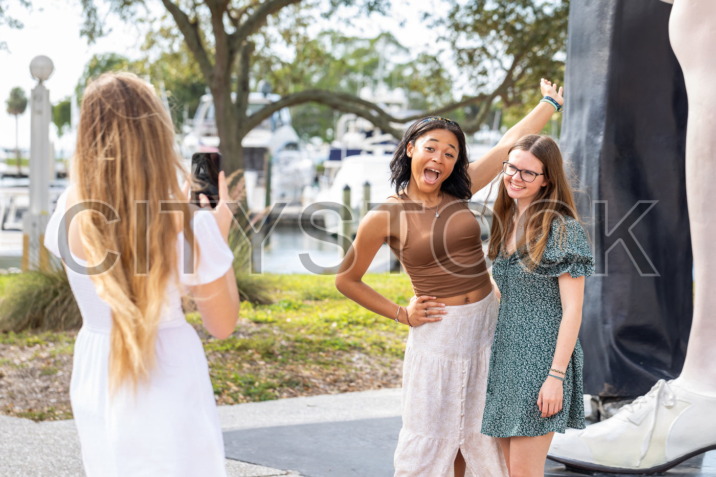 Youthful group of friends having fun at Sarasota Marina