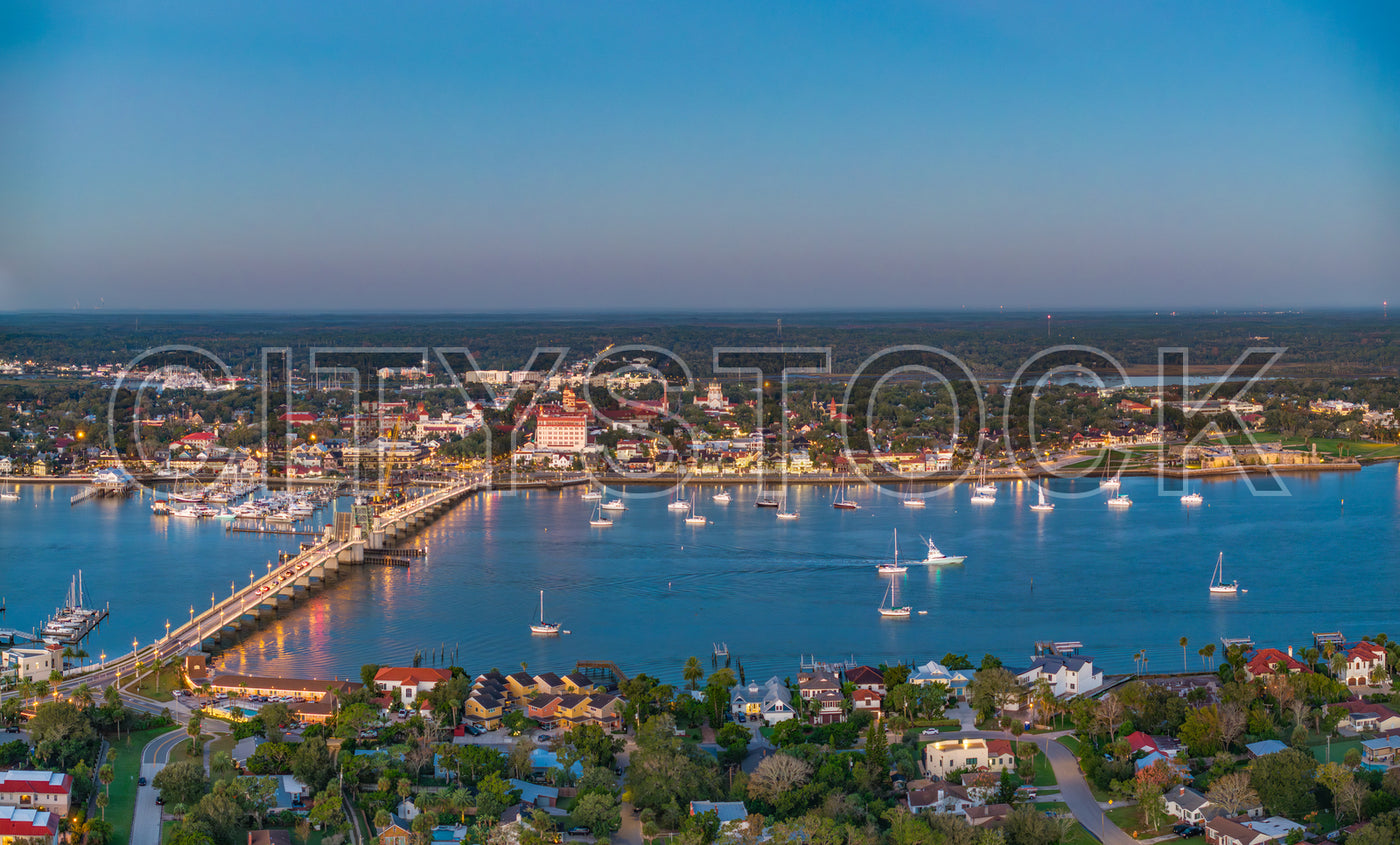 Aerial sunset view of St Augustine, Florida showcasing the Bridge of Lions and marina