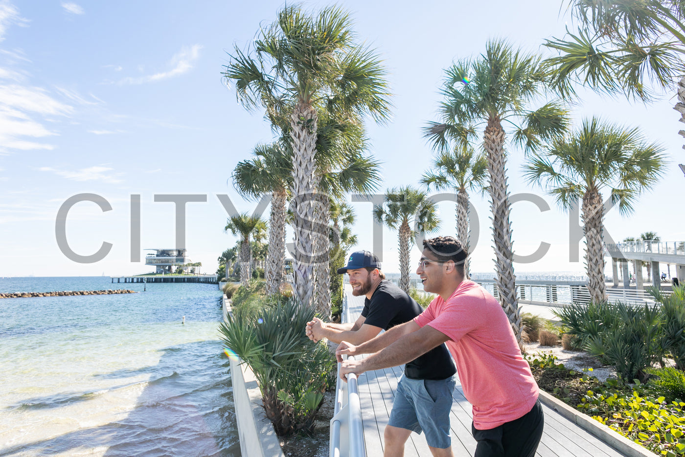 Two friends enjoying a sunny day at St. Petersburg waterfront