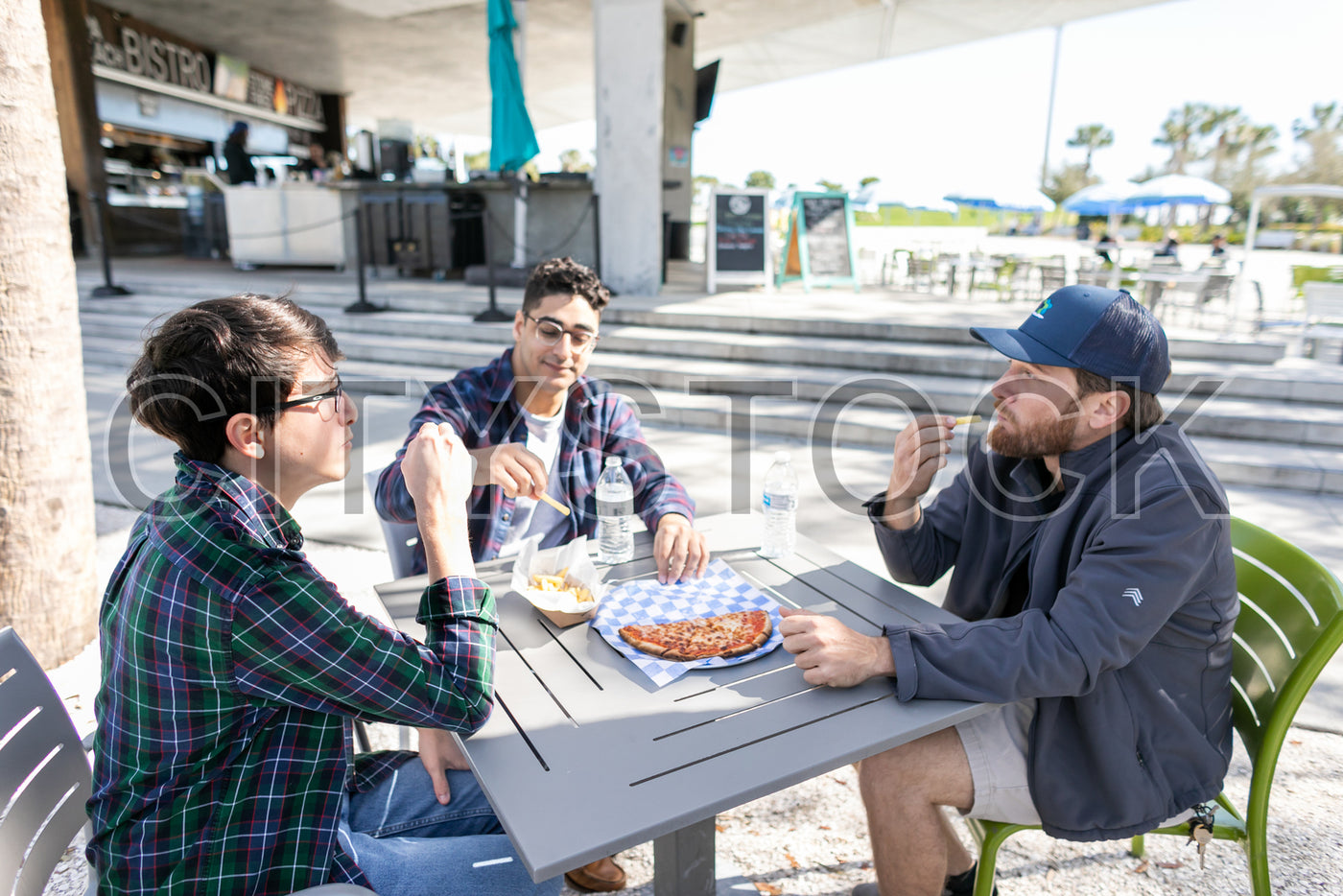 Young adults enjoying casual outdoor lunch in St Petersburg