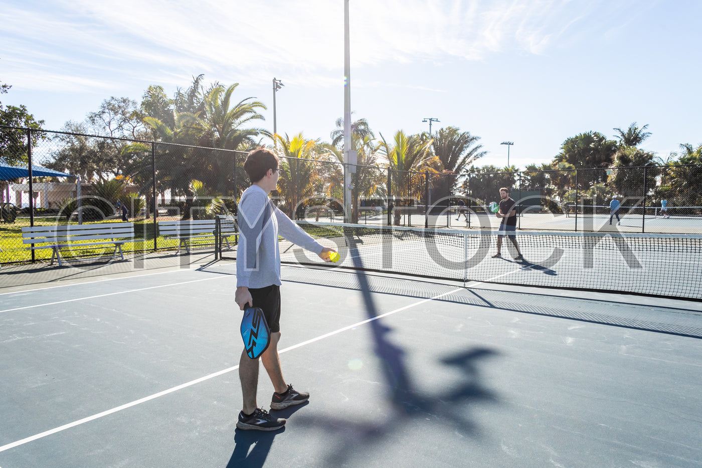 Player preparing to serve in pickleball game, St. Petersburg