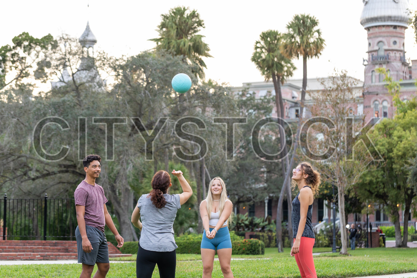 Group of young friends playing with ball in a park in Tampa