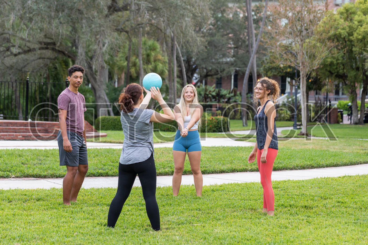 Young Adults Playing Ball Game in Urban Park, Tampa