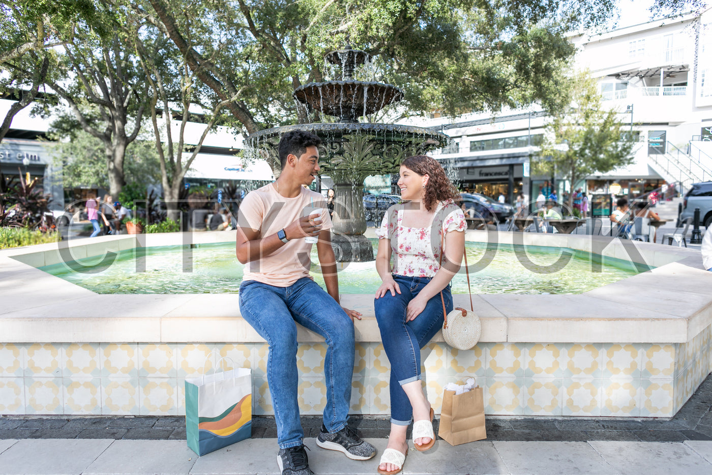 Young couple enjoying casual coffee time at Tampa urban cafe