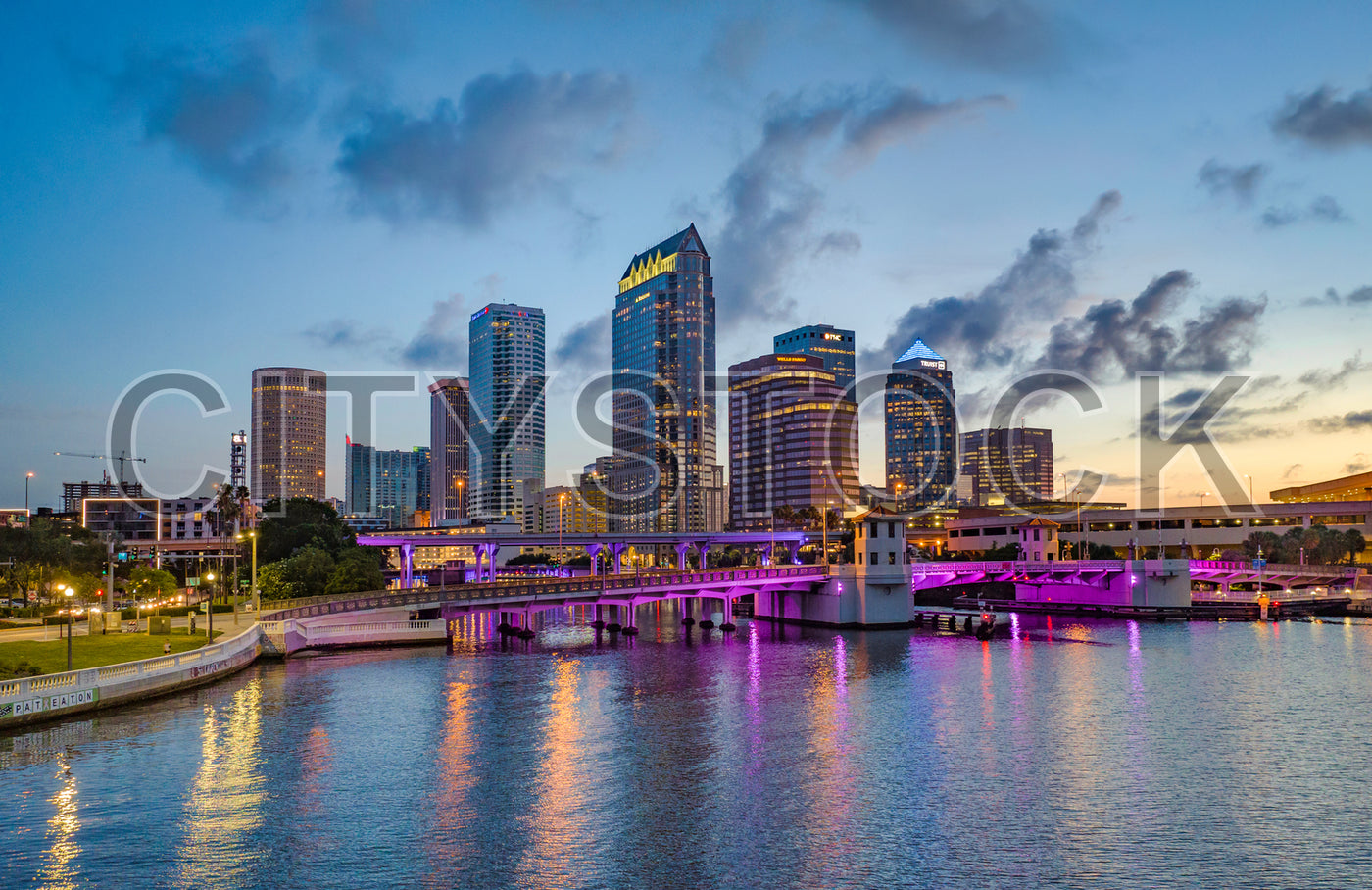 Tampa cityscape at sunset with modern buildings and bridge