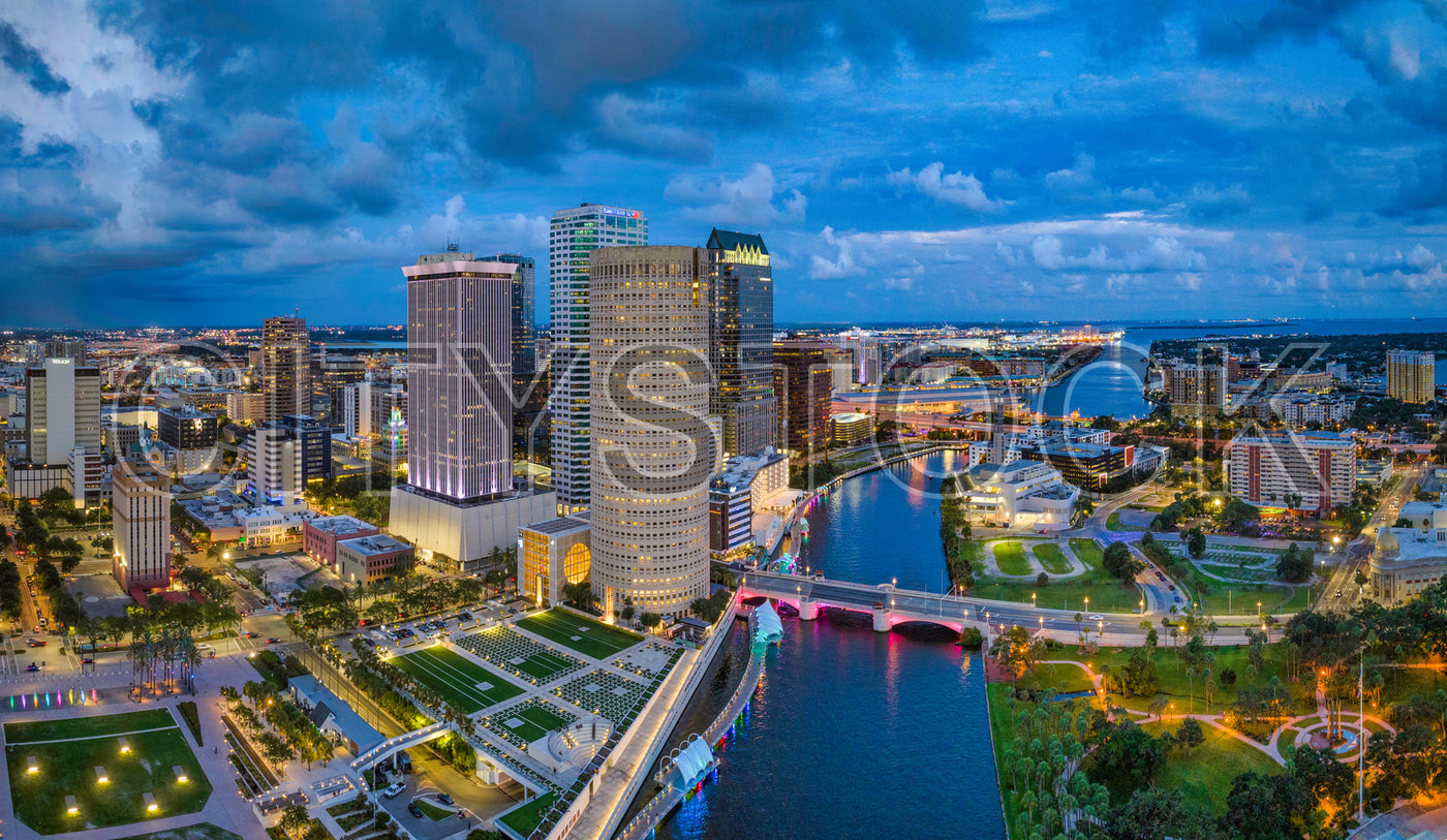Aerial view of Tampa skyline with glowing lights at dusk