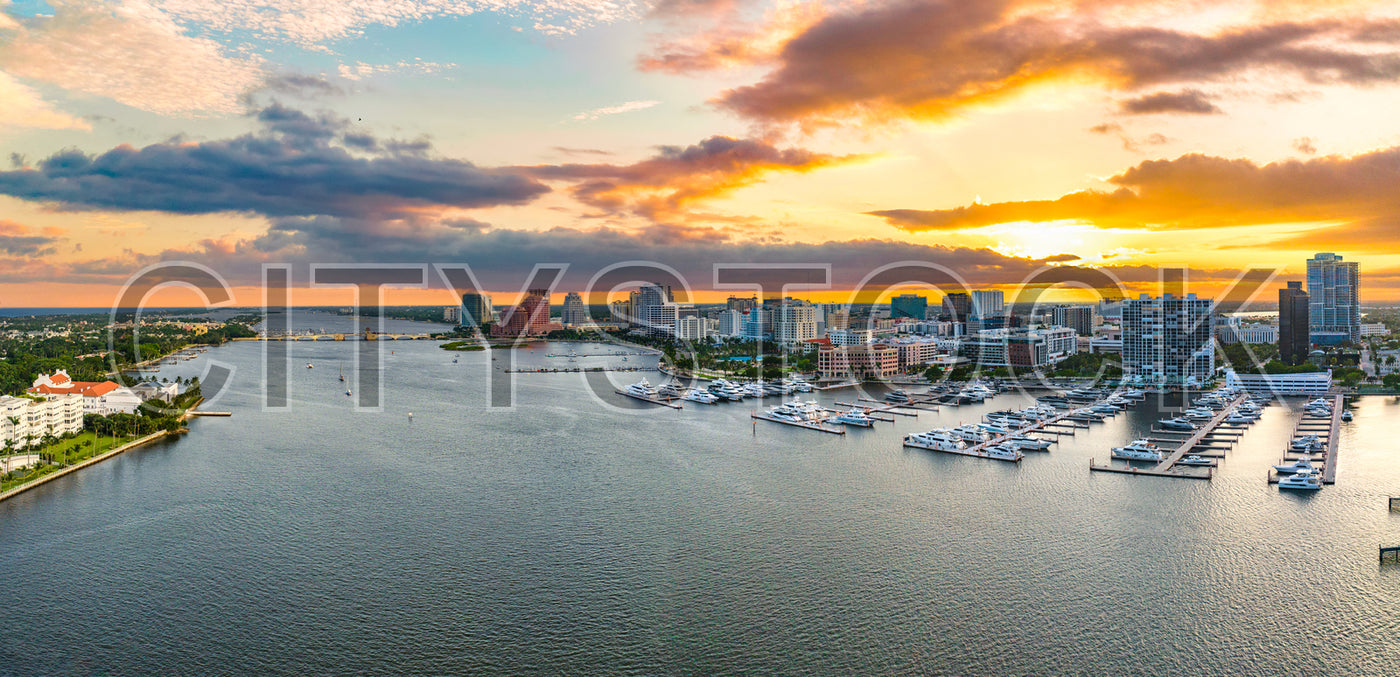 Aerial view of West Palm Beach skyline and marina at sunset