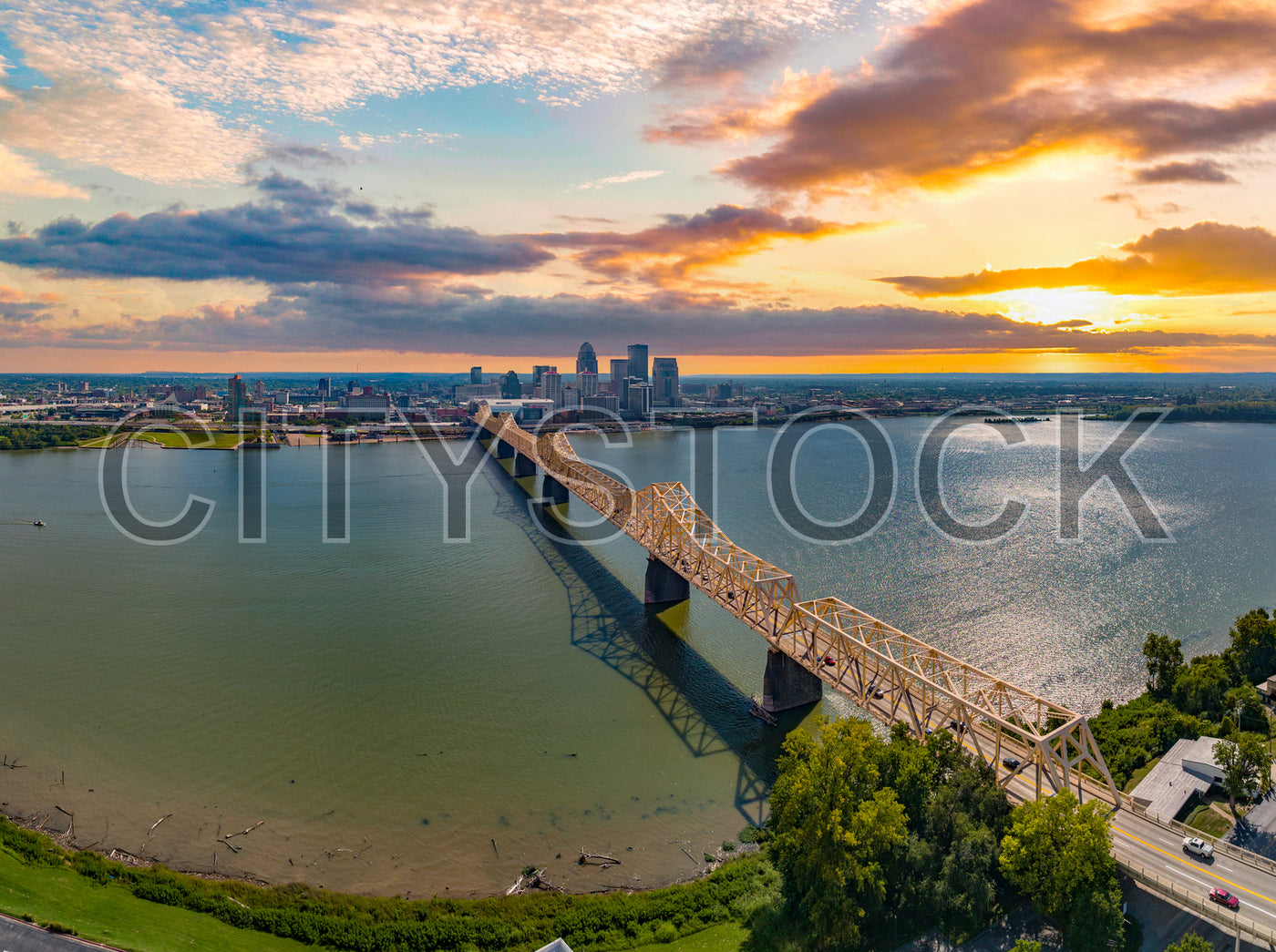 Louisville cityscape with Ohio River Bridge during sunset