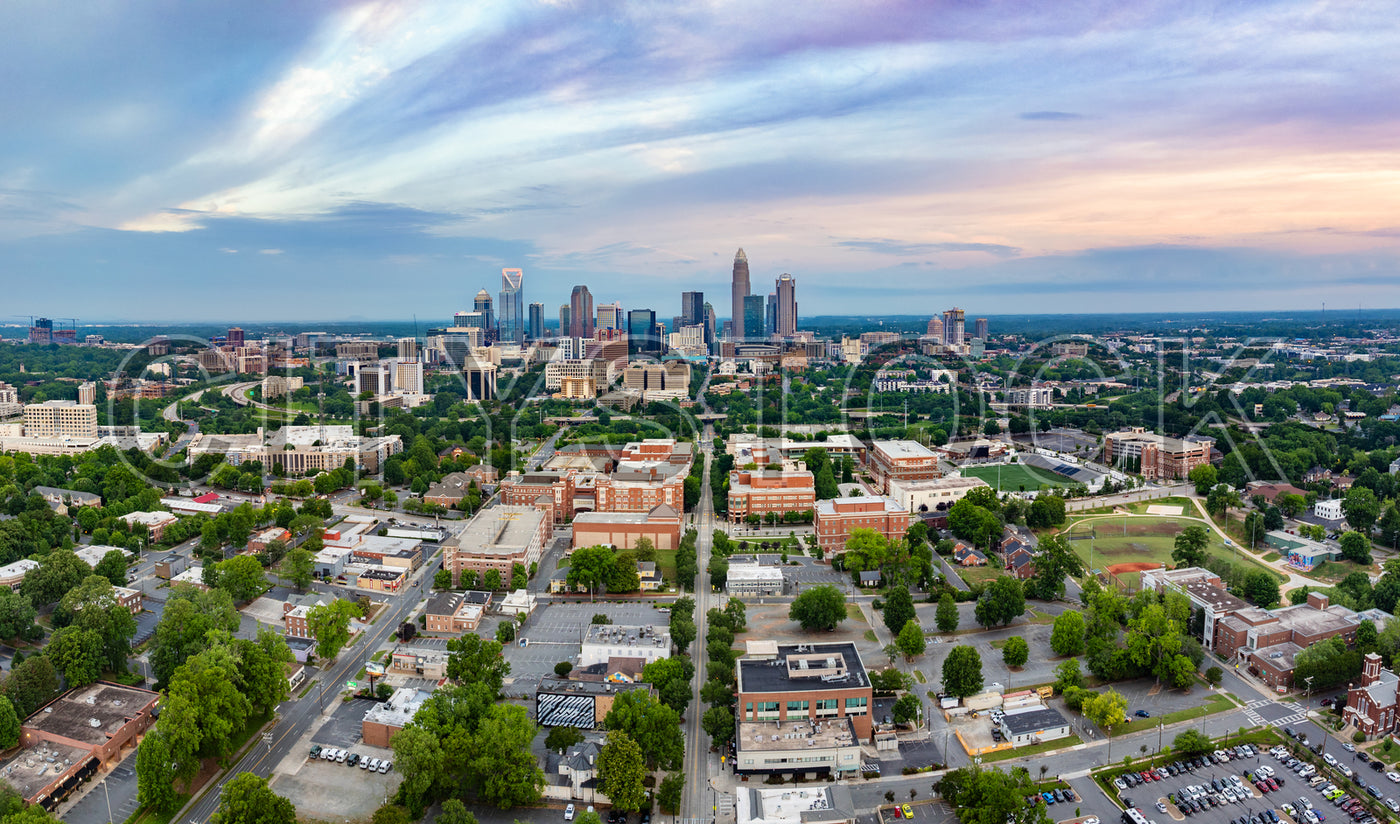 Aerial view of Charlotte skyline at dusk showcasing city lights
