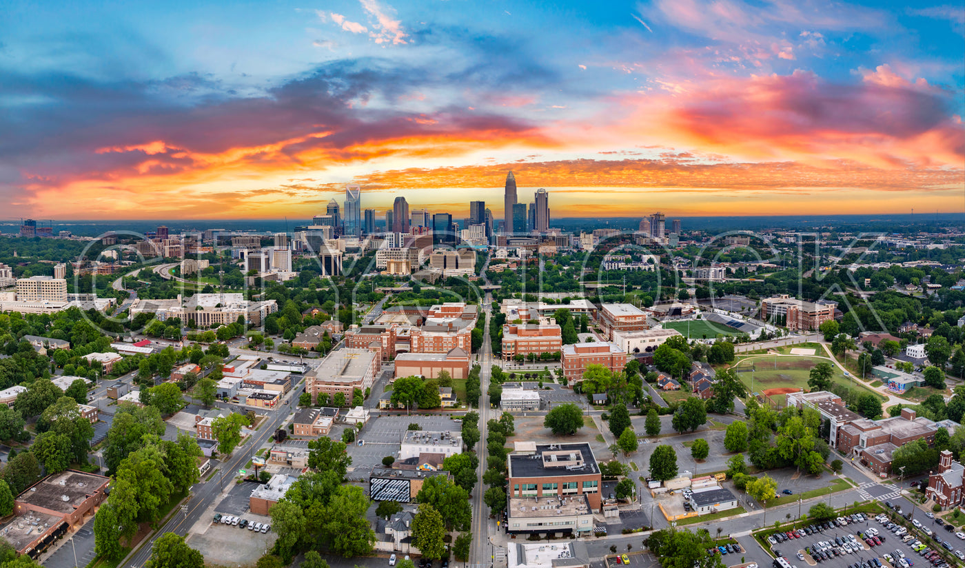 Aerial view of Charlotte skyline at sunset with vivid colors