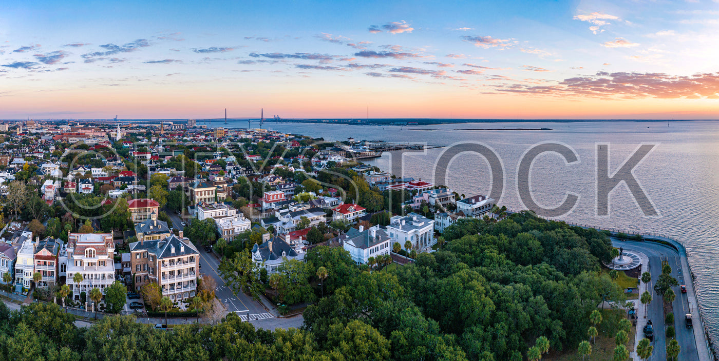 Aerial view of Charleston, SC at sunset highlighting historic and modern architecture along the waterfront