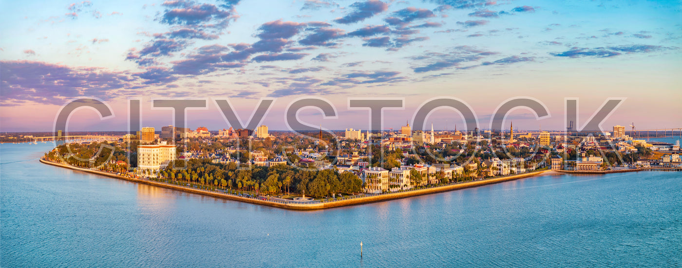 Panoramic sunset view of Charleston cityscape showing historic and urban elements