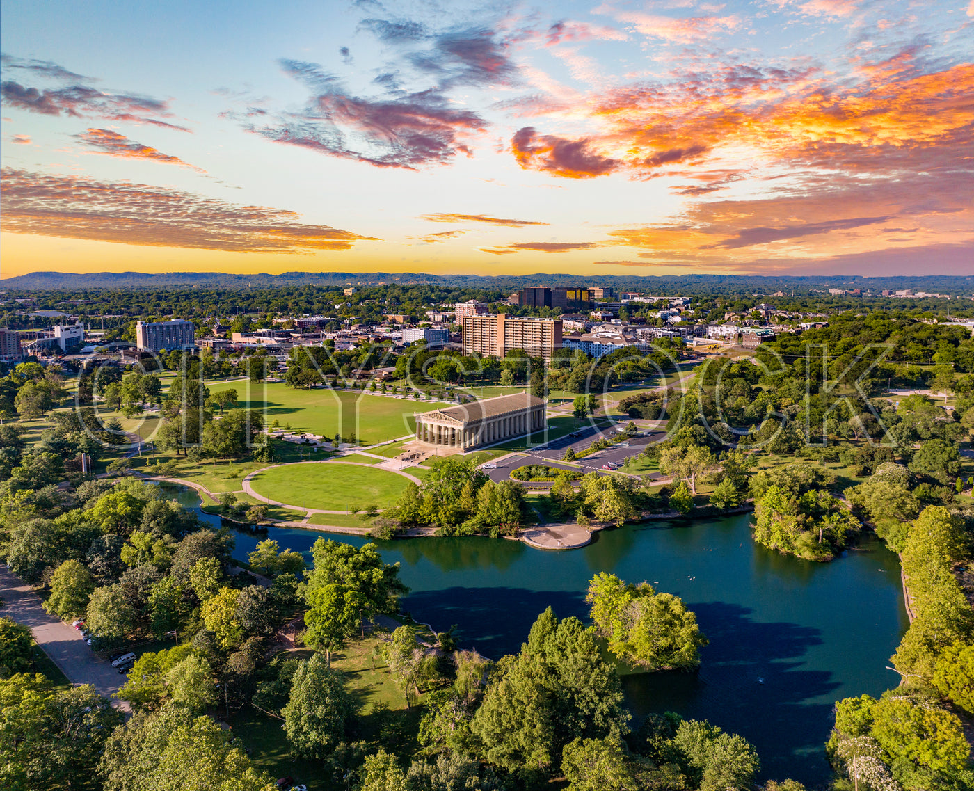 Aerial view of sunset over Nashville city park with river