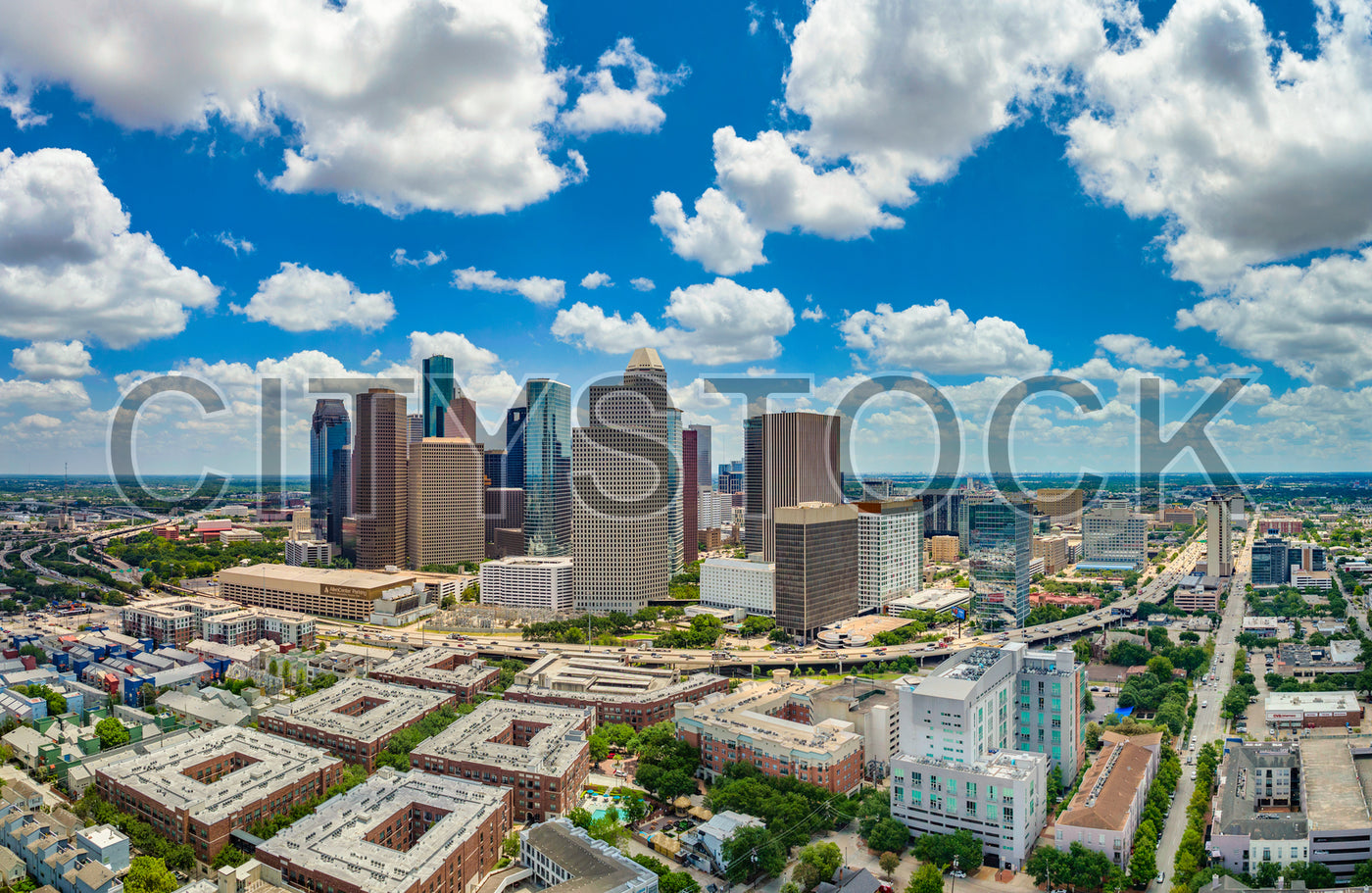 Aerial view of Houston skyline with skyscrapers and cloudy sky