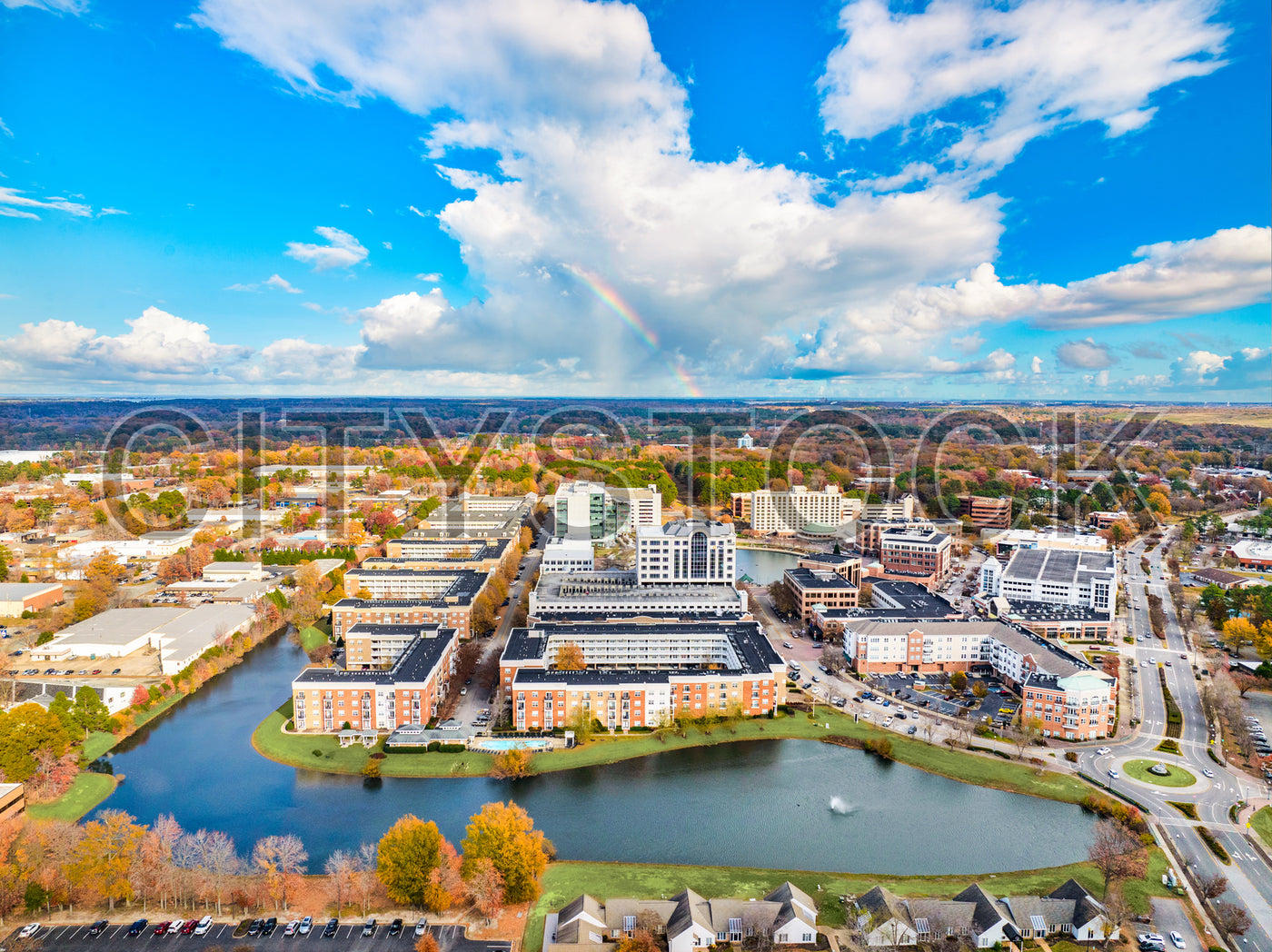 Aerial cityscape of Newport News with dynamic skies and water bodies
