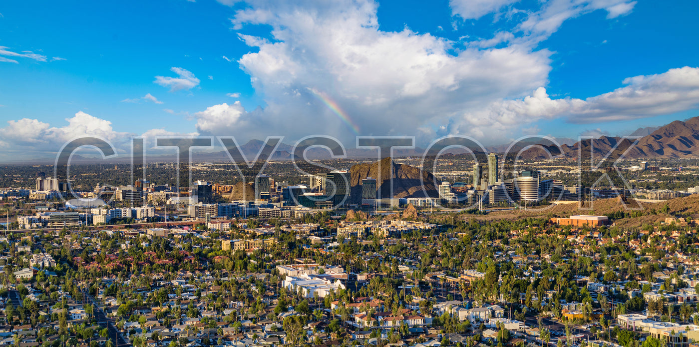 Tempe, AZ city view with rainbow and mountains in the backdrop