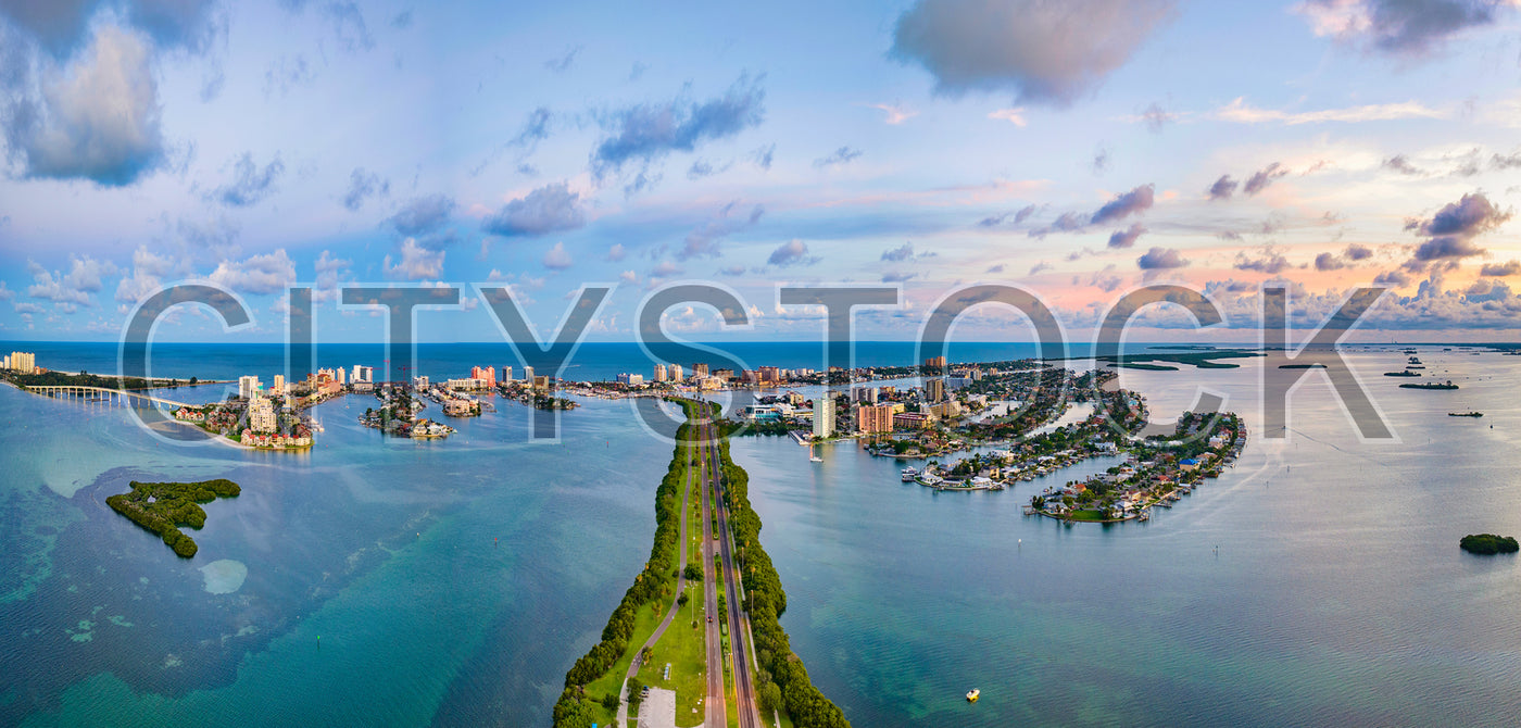 Aerial view of sunrise illuminating Clearwater, Florida coastal urban skyline