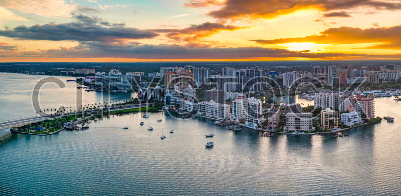 Aerial view of Sarasota Bay at sunset with skyline and boats