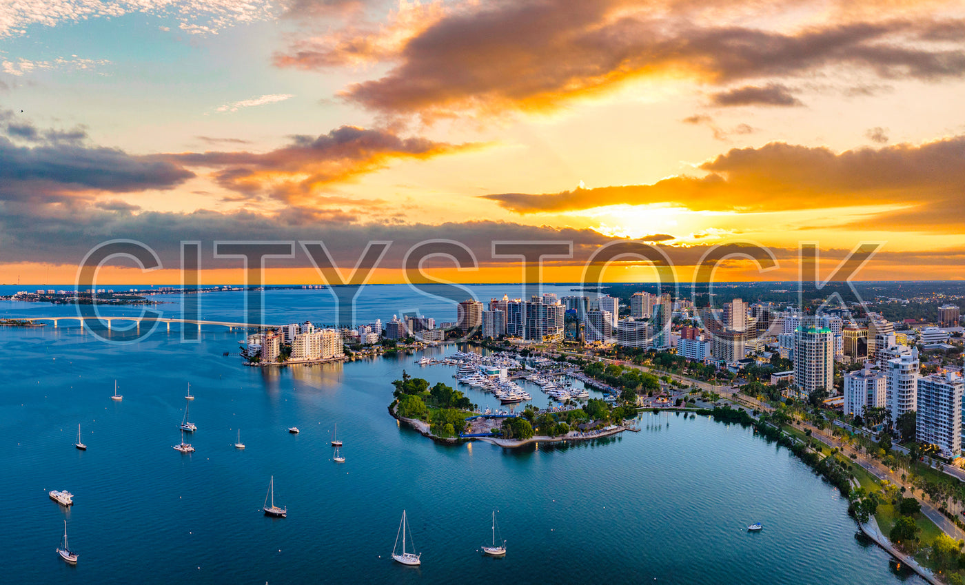 Stunning aerial view of Sarasota skyline at sunset with reflective bay