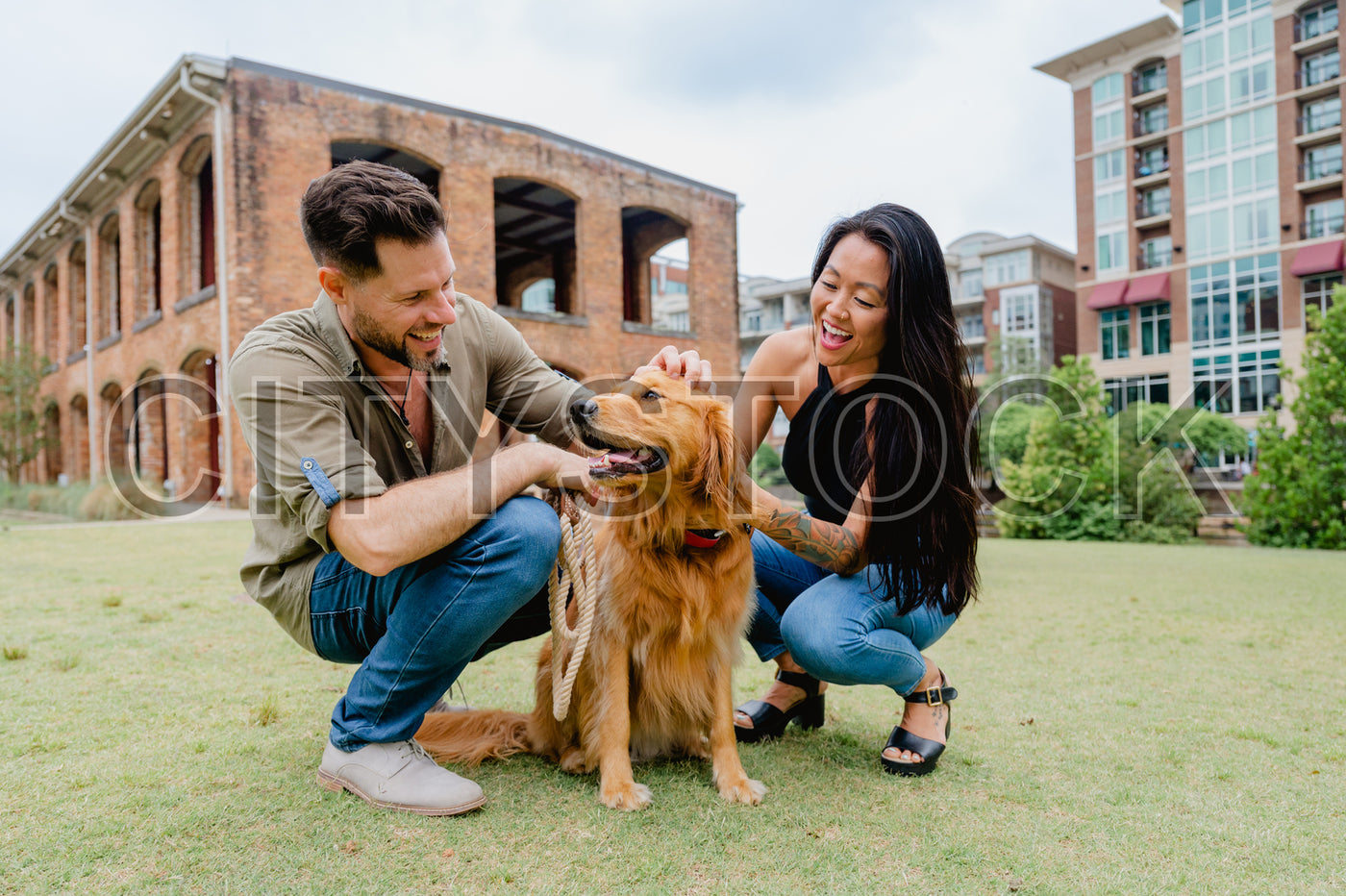 Couple and Golden Retriever Enjoying Time in Greenville Park