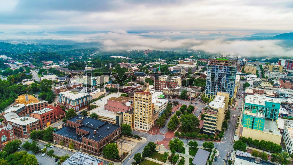 Aerial view of Asheville, NC with morning mist over downtown