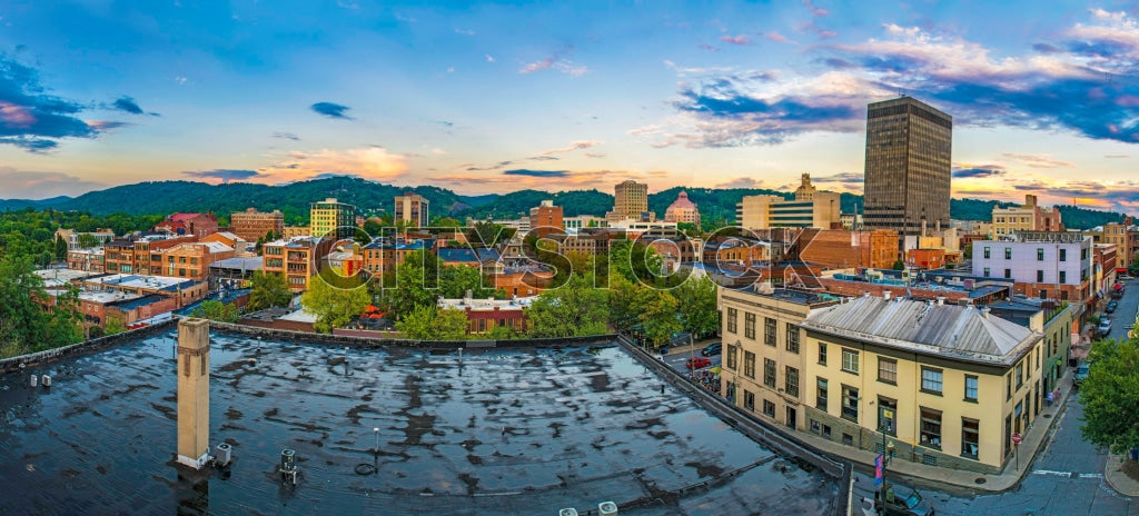Evening view of Asheville cityscape with Blue Ridge Mountains