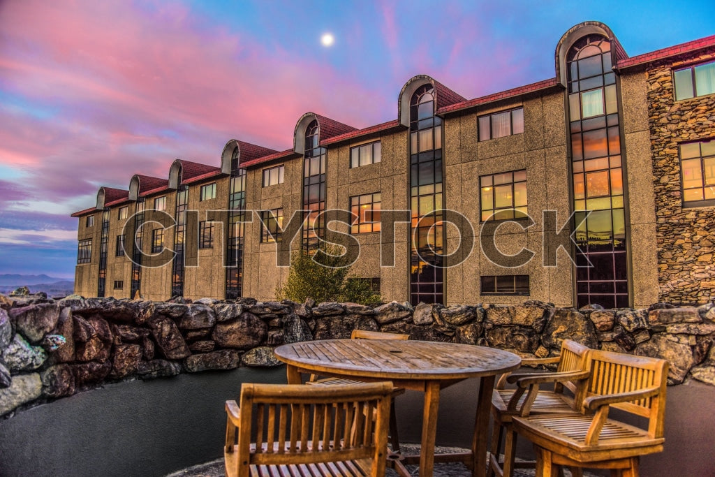 Modern building at sunset in Asheville, waterside seating arrangement
