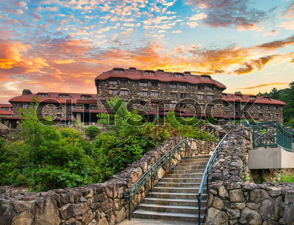 Breathtaking sunset over historic Asheville hotel surrounded by lush greenery