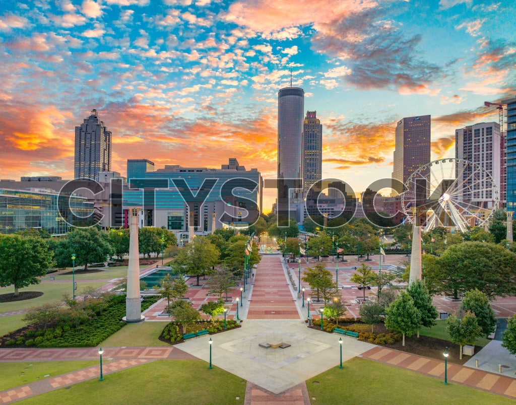 Atlanta skyline at sunrise with scenic clouds and Ferris wheel