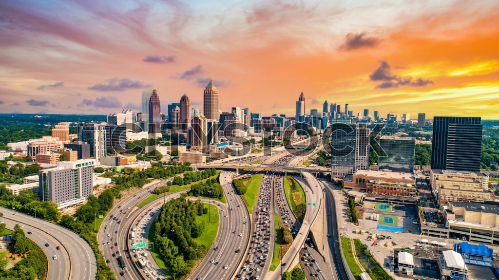 Aerial view of Atlanta skyline and interstate roads at sunset